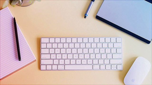 Desk with keyboard and stationery